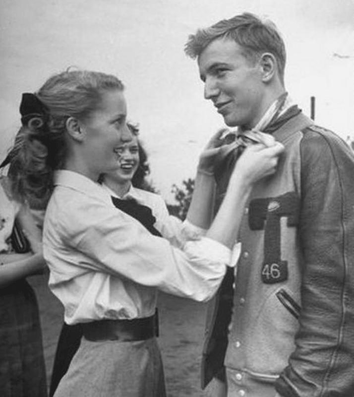 Young-man-with-1950s-letter-jacket-and-young-woman